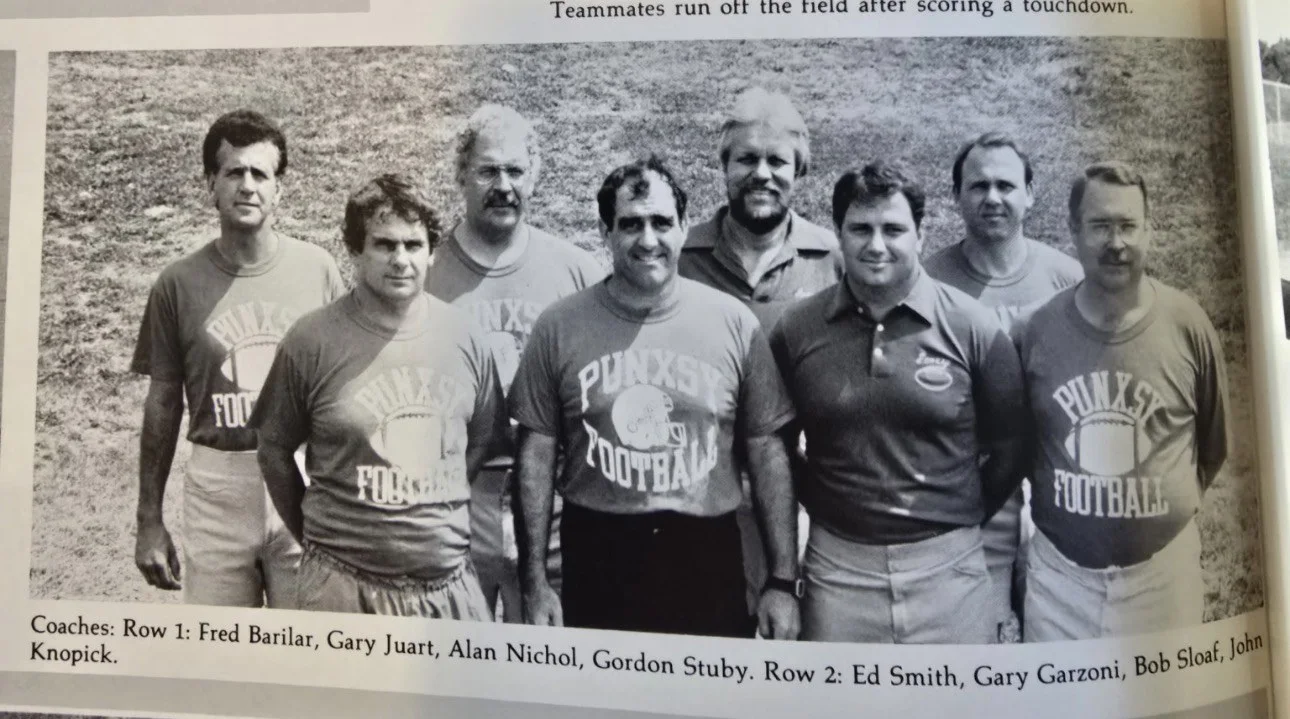 Coaches: (front row) Fred Barilar, Gary Juart, Alan Nichol, Gordon Steuby; (back row) Ed Smith, Gary Garzoni, Bob Sloaf, John Knopick.